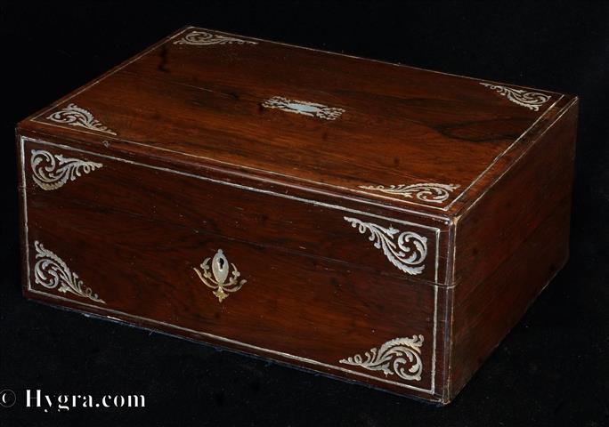 An antique rosewood sewing box with contents