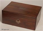 732SB: Early Victorian rosewood and mother of pearl inlaid box with a sewing tray covered in the original printed paper and blue silk, with compartments for threads and sewing tools, circa 1850.
