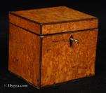 745TC:  Single compartment tea caddy veneered with bird's eye maple with a dark brown banding, the inside with a mahogany lid, Circa 1790. 