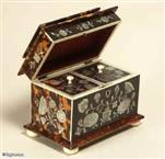 TC 113:  A particularly fine mother of pearl inlaid tortoiseshell two compartment tea caddy with pagoda top and molded base having ivory facings  standing on turned ivory feet  the inside  with supplementary lids which are also inlaid. Circa: 1825.
