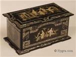 721TC-FR-hygra: Two compartment tea caddy decorated with Chinoiserie executed in inlaid mother of pearl.  On first sight this looks like papier mch but it is in fact ebonised wood decorated in a manner which suggests papier mch. The top is decorated with figures in a landscape with buildings. This exotic fantastical scene is  rooted in the Chinoiserie tradition, which reflected both the narratives and drawings brought back from the East by the first explorer/traders. One feature of the orient which captured the imagination of the Europeans was the extensive ornamental gardens complete with lakes and small islands, enjoyed by the cultural elite. Circa 1850.