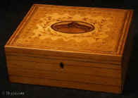 JB509: Inlaid maple Tunbridge ware box with a central book-matched medallion in burr yew, framed by by a formal design of delicate foliage, suggesting the Grecian laurel or myrtle wreath and further framed by cross bandings. Inside the box  has a liftout tray with two supplementary lids also with inlay. The edges have an inlay in alternating maple and rosewood. Circa1790 Enlarge Picture