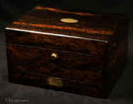 JB510: Antique highly figured coromandel box by J J Mechi with rounded edges, opening to a compartmentalized interior with lift out tray and a sprung drawer fitted for jewelry. there is a document wallet to the lid . The box features a working Bramah lock. Circa 1840. Enlarge Picture