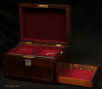 JB556: Figured rosewood box  with inlay of white metal and mother of pearl escutcheon inside having a velvet lined liftout tray and side drawer of dovetail construction making box  ideal for jewelry. Circa 1845. 