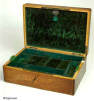 A French rosewood box with boxwood inlay and rounded corners. The box is lined with its original  green leather and velvet having a liftout tray and document wallet lined with yellow and green silk. circa 1835.