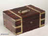 JB216: A Regency figured rosewood box with rounded edges, all brassbound, with liftout tray, document wallet, and mirror; the box having a countersunk carrying handle to the top,  and working lock and key. circa 1830. Enlarge Picture