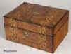  JB229 Box veneered in walnut and inlaid in strips of geometric marquetry of light and stained woods circa 1890. Enlarge Picture
