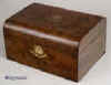 JB231: A dome top figured walnut box with brass escutcheon and accents retaining its original green satin padding to the lid and having a refitted liftout tray, circa 1890. Enlarge Picture