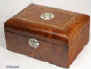 JB307: Antique, late 19th c. box, with the top curved veneered with amboyna, and inlaid with parquetry, and having an escutcheon and central inlay to the top depicting a compass point star in contrasting mother of pearl and abalone. Inside, the box has a replacement liftout tray lined with velvet and suitable for jewelry and knickknacks.  Circa 1890. Enlarge Picture