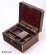 JB310: A  brass edged coromandel jewelry box, by H. Trussell of Brighton the hinged lid opening to reveal a velvet and gold embossed lined interior and two lift-out trays. The box has a working Bramah lock and key. Circa 1840.  Enlarge Picture
