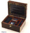 JB311: Brass edged figured rosewood box with brass escutcheon and a brass plate, having a lift out tray. The box has a document wallet with gold and blind embossing to the lid and a working lock and key. Circa 1830 Enlarge Picture