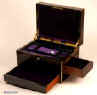 JB312: Antique box veneered in strongly figured  coromandel, on a mahogany construction with rounded brass edging to all sides,  and  working Bramah lock with key. The box is high quality, which continues into the interior. It is lined in velvet, and embossed leather. It has two  sprung drawers which are  fitted for jewelry released by pressing buttons,  Circa 1840. Enlarge Picture