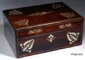 SB123: Antique figured rosewood box with dramatic contrasting mother of pearl inlay depicting native plants, the box opening to a fitted inside with liftout tray with divisions for sewing. The tray is covered in its original 19th C paper and has supplementary lids covered in blue silk. The box has a rounded filet of solid rosewood let into the edges. All the veneers at this period are saw cut and about 1mm thick. Circa 1835. Enlarge Picture