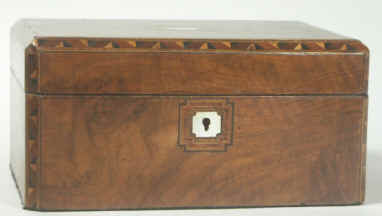 Victorian walnut veneered box inlaid in strips of geometric marquetry circa 1880. Enlarge Picture