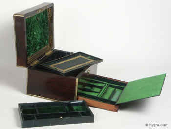 A fine Antique brass edgedRosewood box Circa 1850 with liftout trays and silk lined drawer. Enlarge Picture