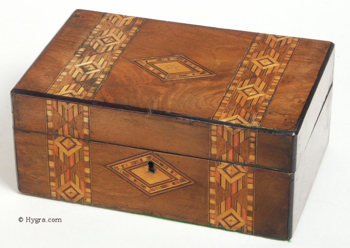 Box veneered in walnut and inlaid in strips of geometric marquetry of light and stained woods circa 1880Enlarge Picture