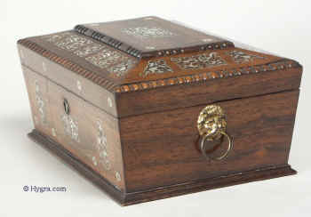 A Shaped Rosewood box with Mother of Pearl inlay having a velvet lined lift-out tray Circa 1840.