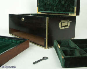 A coromandel ebony box with brass edging with a drawer and tray fited for jewelry circa 1860. Enlarge Picture