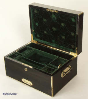 A coromandel ebony box with brass edging with a drawer and tray fited for jewelry circa 1860.  Enlarge Picture