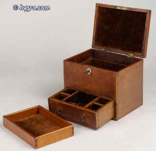 JB228:  A small mahogany box edged with boxwood, fitted for jewelry with lift out tray (later) and lower drawer having a working lock and key circa 1840. Enlarge Picture