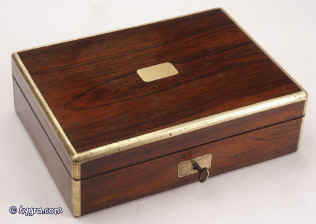 JB309: Brass edged figured rosewood box with hinged lid opening to compartmentalized interior with supplementary lids and liftout tray 1830. Enlarge Picture
