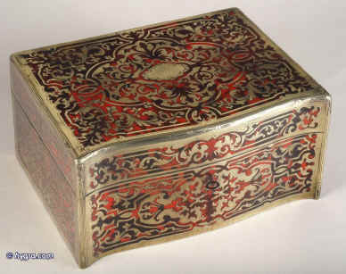 JB315: Boulle box in brass and red tortoiseshell having a serpentine front. and engraved brass and Boulle in red tortoiseshell depicting stylized scrolling  floral motifs to top sides and front.   The box is lined with silk and velvet. Circa 1840. Enlarge Picture