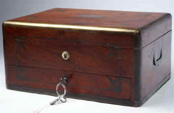 -JB439: Brass edged and inlaid solid rosewood box suitable for jewelry having inset brass carrying handles, working Bramah lock  with key  and a separately locked drawer. There is an adjustable mirror in the lid. The main section of the box has several sections some with supplementary lids. Circa 1825. Enlarge Picture