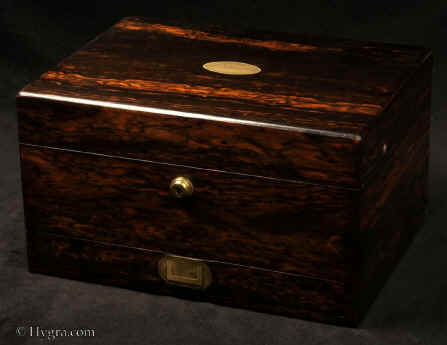 JB510: Antique highly figured coromandel box by J J Mechi with rounded edges, opening to a compartmentalized interior with lift out tray and a sprung drawer fitted for jewelry. there is a document wallet to the lid . The box features a working Bramah lock. Circa 1840.Enlarge Picture