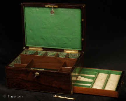 JB554:Georgian brass edged figured rosewood box with compartmentalized  interior and side drawer fitted for jewelry. The box has a working Bramah lock with key and a document wallet to the lid. Circa 1820.  Enlarge Picture