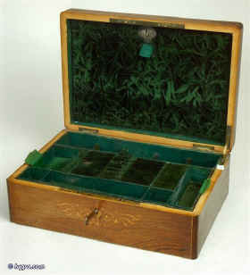 A French rosewood box with boxwood inlay and rounded corners. The box is lined with its original  green leather and velvet having a liftout tray and document wallet lined with yellow and green silk. Enlarge Picture