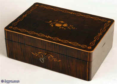 jb179: Antique harewood box with rounded corners edged with boxwood and finely inlaid with floral motifs in boxwood. circa1850 Enlarge Picture