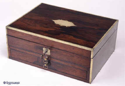 jb189: A unusual brass edged figured rosewood box with a drawer fitted for jewelry, an upper compartmentalized tray and a writing slope. Enlarge Picture