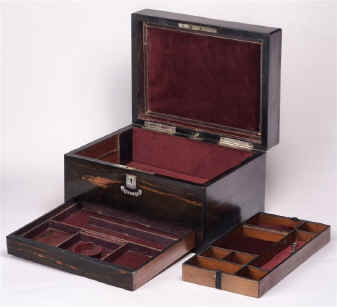 JB190: A richly figured coromandel box with liftout tray and sprung drawer fitted for jewelry with mother of pearl escutcheon. circa 1860 Enlarge Picture