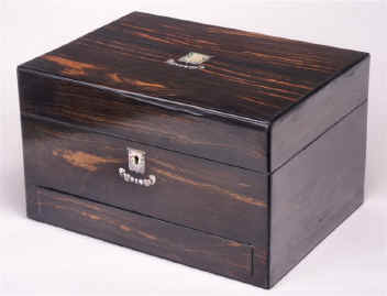JB190: A richly figured coromandel box with liftout tray and  sprung drawer fitted for jewelry with mother of pearl escutcheon. circa 1860 Enlarge Picture