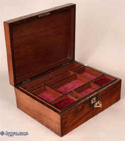  A figured walnut box, the top with a chamfered edge veneered with contrasting ebony inlaid with a white-metal line, the inside lined with mahogany and having   a divided liftout mahogany tray circa 1860 Enlarge Picture