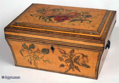 An unusual painted Regency box with curved and tapered sides and pyramided top, having replacement side handles and and opening to two replacement velvet covered lift out trays making the box suitable for jewelry or sewing circa 1810. The wood is sycamore and the painting depicting floral motifs is finely executed. A wonderful period piece. Circa 1860. Enlarge Picture