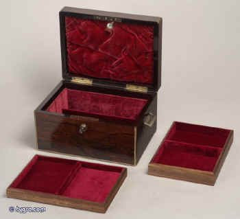 Antique, early 19th Century brass edged box in figured rosewood by T. Briggs of 27 Piccadilly, London, with working Bramah lock, inset side carrying handles, having a velvet lined interior, two (replacement) lift out trays, embossed leather document wallet in lid, circa 1820. Enlarge Picture