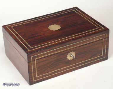 Antique figured rosewood veneered box with brass inlay having a replacement liftout tray and original leather document wallet in the lid, working lock and key, Circa 1820. Enlarge Picture