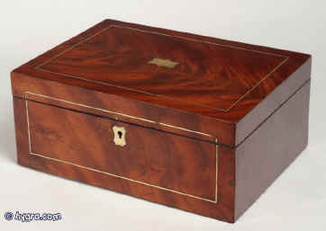 JB222.: Beautifully figured mahogany with brass stringing, escutcheon and central plate, inside having a replacement liftout tray and lining. circa 1820. Enlarge Picture