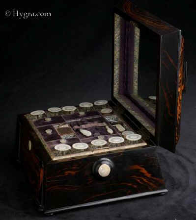 SB492: An impressive sewing box veneered in saw cut highly figured coromandel, fitted with mother of pearl sewing tools. Enlarge Picture