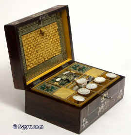 George IV,  period fully fitted sewing  box veneered in highly figured rosewood and inlaid with mother of pearl depicting stylized flowers by Dobson, Manufacturer, 162 Strand, London Enlarge Picture