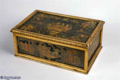 Rare important early 18th Century Venetian box with fielded panels decorated with lacca povera  depicting Chinoiserie fantasies, framed with gilt-wood; the inside of the box has a later (early 19th century English) tray, covered in green silk fitted for sewing, circa 1730 Enlarge Picture