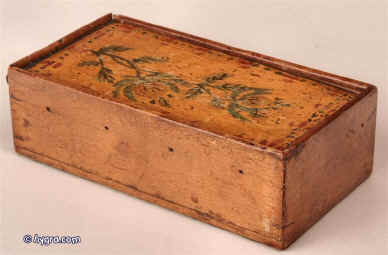 A Tunbridge painted sycamore thread box, the top decorated with a painting of sprigs of carnations to the sliding lid, opening to  eight compartments for holding cotton reels, the sides with holes through which the thread was dispensed circa 1800 Enlarge Picture