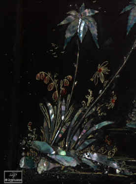 A serpentine fronted two compartment papier mch tea caddy decorated with chinoiserie painting on an iridescent pearl shell inlay. Enlarge Picture