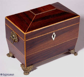 A  Regency shaped rosewood caddy with pyramided top with  brass  side handles and feet Circa 1830 Enlarge Picture