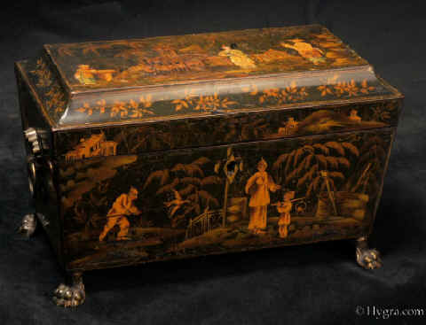 TC139:A polychromed tea chest painted in a fluid hand with an exotic scene. The elongated figures, the inverted flower hats, and the lightness of execution suggest a knowledge of later more refined chinoiserie design. The top is similarly decorated gently built up into three dimensions using white size and fine plaster gessom Circa 1820.Enlarge Picture
