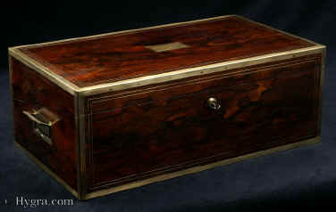 WB429: Important Regency brass edged and inlaid writing box with double layered secret compartments and drawers by Thomas Lund of Cornhill,a replacement leather writing surface and compartments for pens and stationery. The secret compartments include a rare sprung false bottom. Enlarge Picture