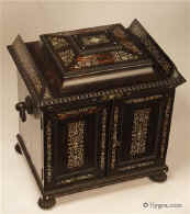 630JB: A monumental  coromandel ebony compendium table cabinet  of architectural form having turned and carved feet and handles. It is profusely inlaid to the top and front with mother of pearl. Enlarge Picture