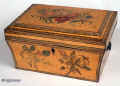 An unusual painted Regency box with curved and tapered sides and pyramided top, having replacement side handles and and opening to two replacement velvet covered lift out trays making the box suitable for jewelry or sewing. The wood is sycamore and the painting depicting floral motifs is finely executed. A wonderful period piece. Circa 1810. Enlarge Picture