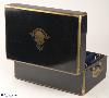 JB420: Brass bound French ebonized box by L. Aucoc aine, Paris with inlaid armorial Achievement for Bingham/ Pemburton/ Chaldicott. The box has a working Bramah lock, opening to a leather and silk covered compartmentalized interior. There are compartments and small containers which fit snugly into their allotted spaces. There is also a secret sprung drawer. Everything is covered in original leather and silk. The hinge is heavy allowing for the weight of the box. It also has the self supporting structure which helps the heavy lid stay open.  Circa 1860.    